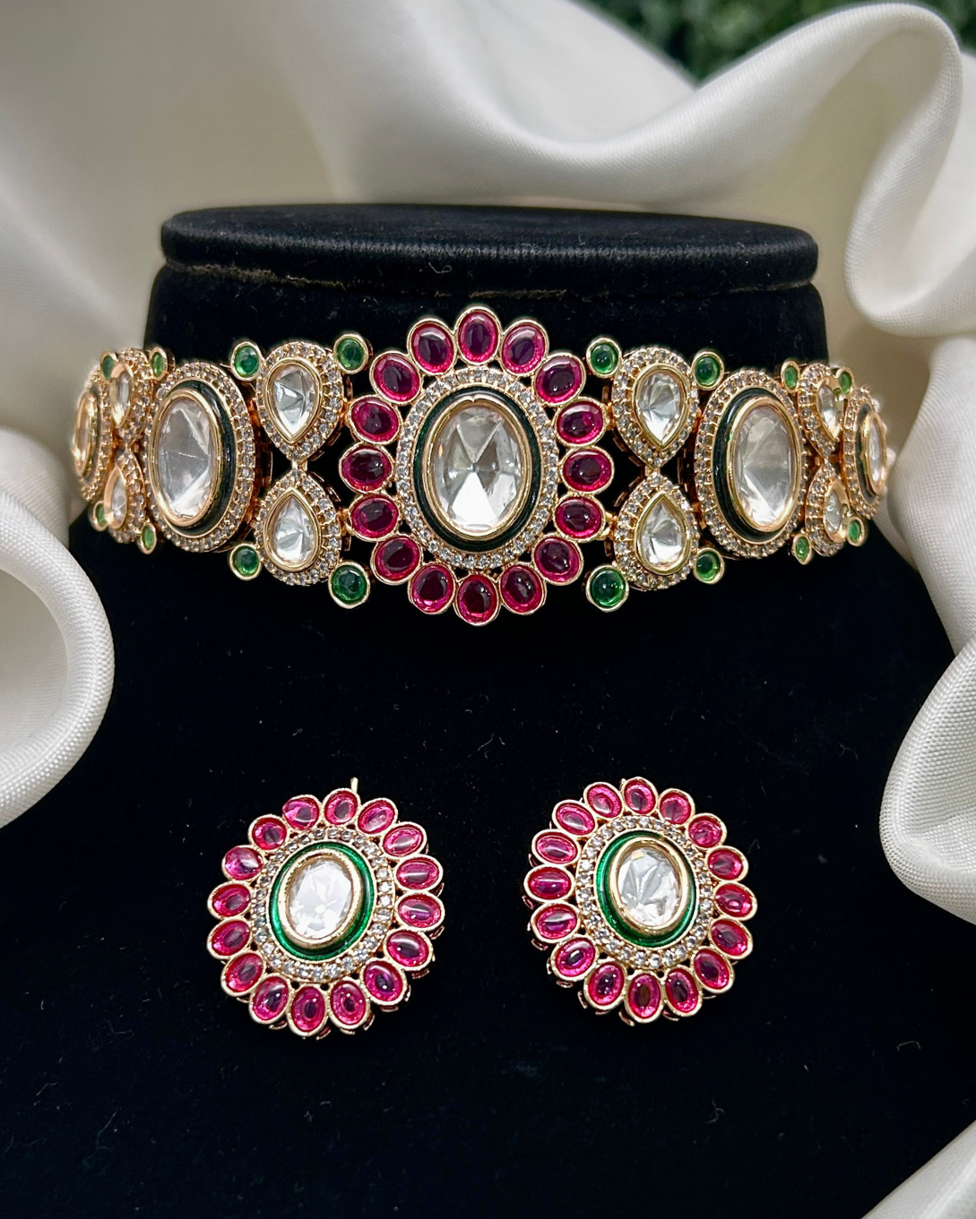 Elegant Kundan choker with vibrant ruby accents.