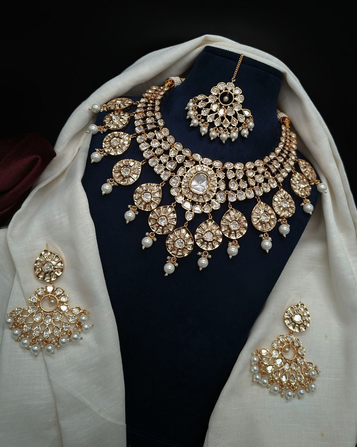 Complete royal Kundan Bridal Set featuring a Necklace, matching Earrings, and Maang Tikka.